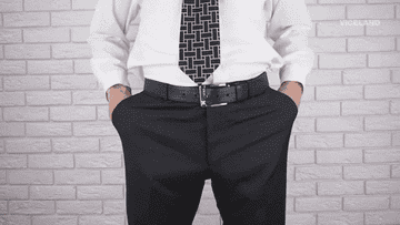Man pulling his pants pockets out to show they&#x27;re empty
