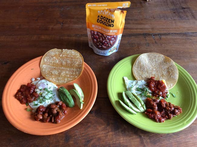 reviewer's bag of pinto beans and some on a plate with avocado, tortillas, and cheese