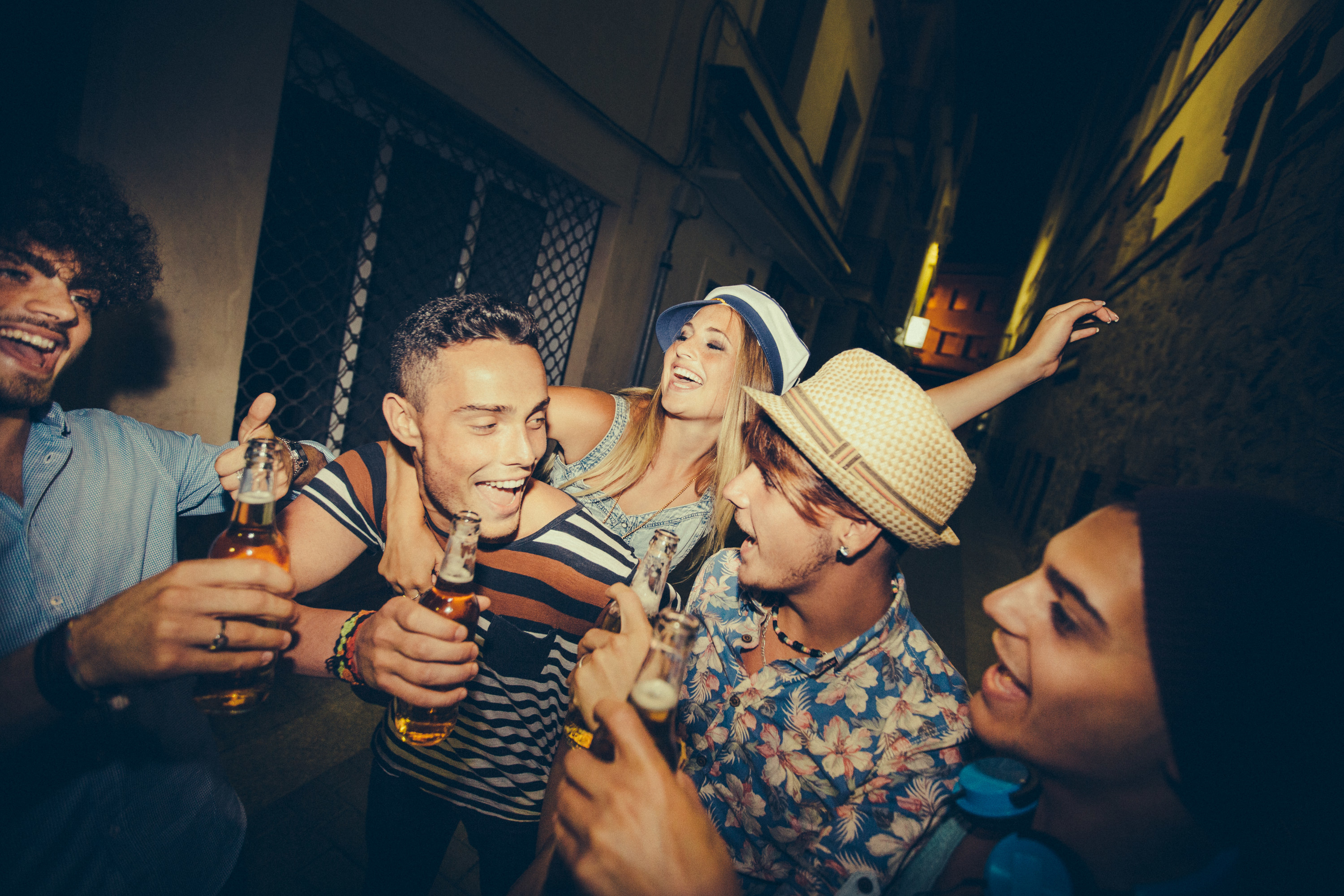 group of teens drinking outdoors