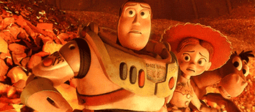 Buzz reaching for Woody&#x27;s hand in the furnace