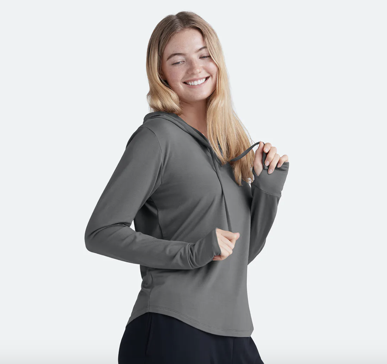 model wearing the gray hoodie 