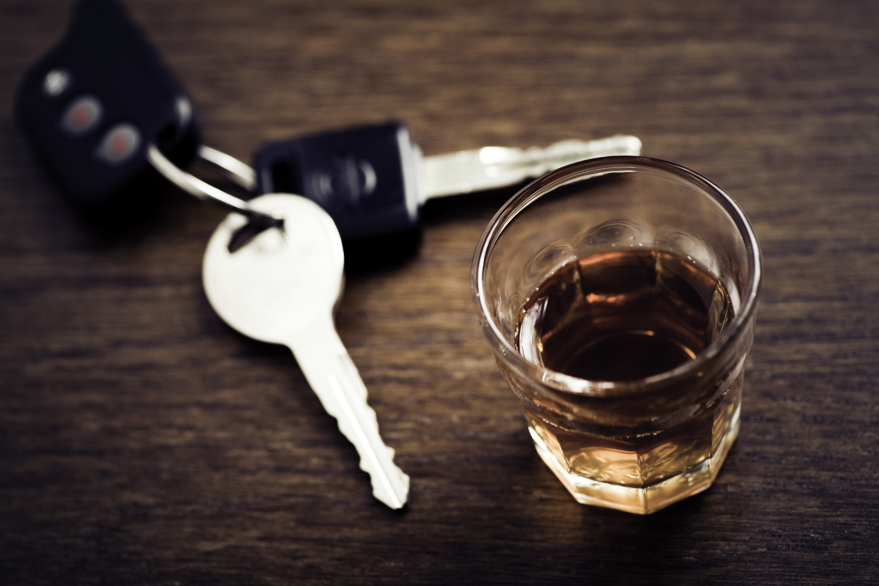 shot glass next to car keys