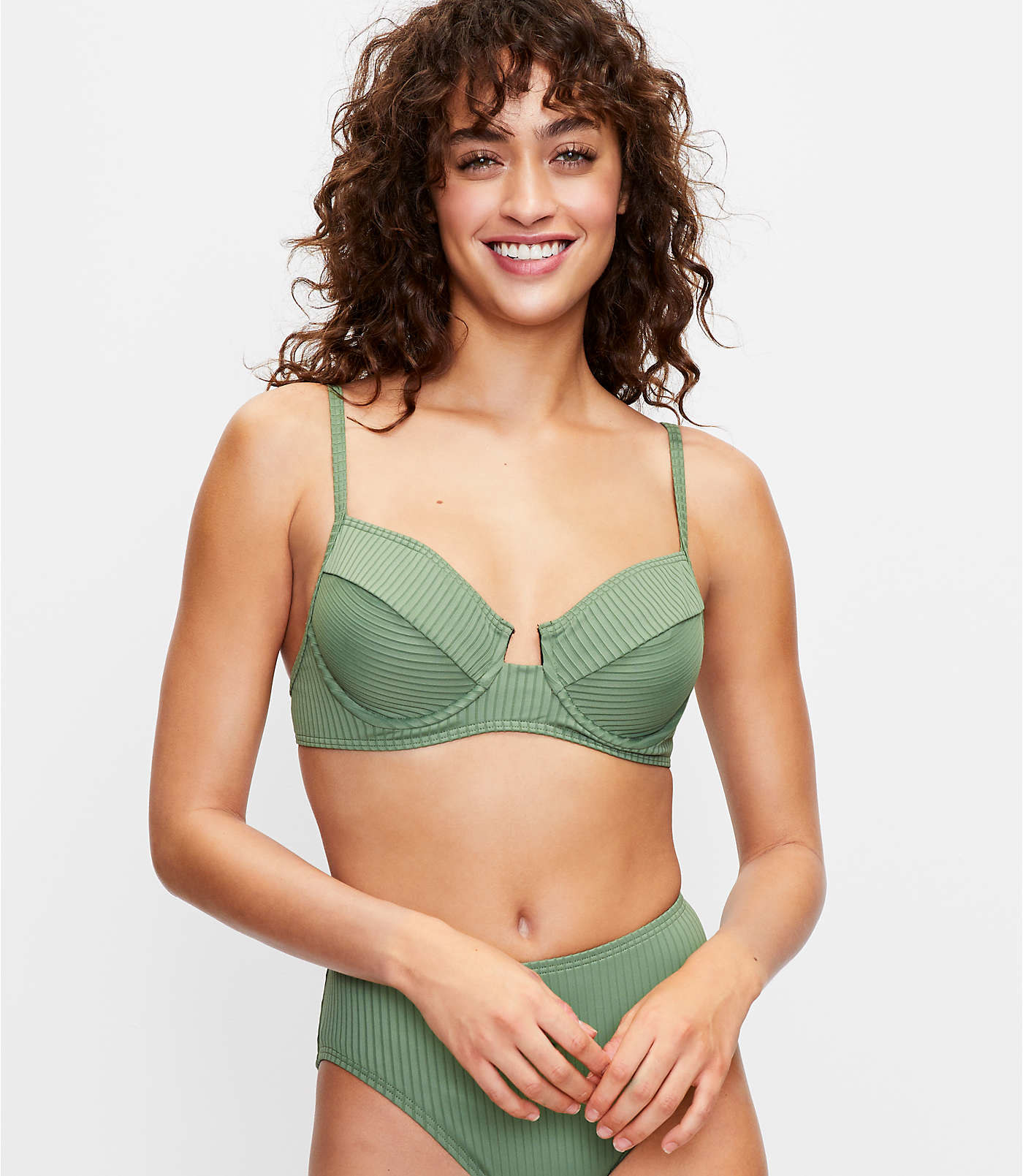  model wearing the high-waisted ribbed bottoms and underwire top in green