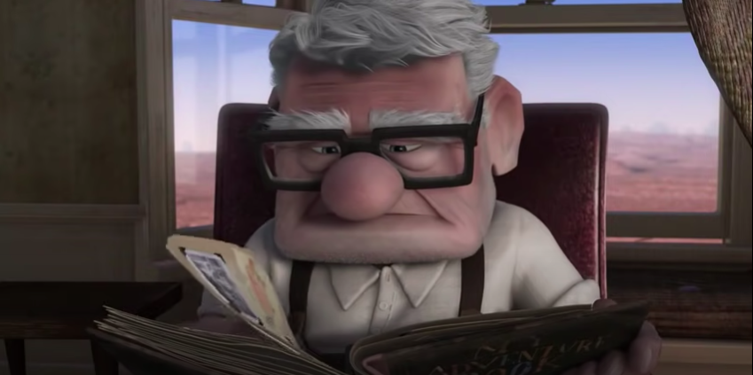 Carl from &quot;Up&quot; looking in an old photo album 