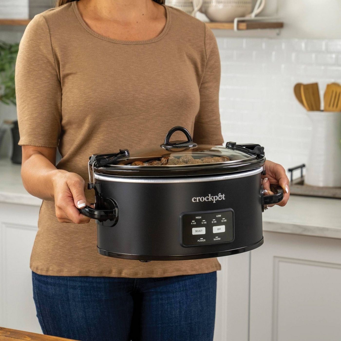 The Crock-pot, which has handles and special clamps to keep the lid in place while traveling
