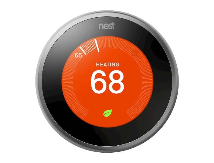 The thermostat, which is round and has a touch screen