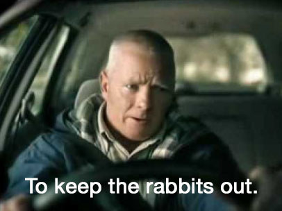 A man drives a car with the caption &quot;to keep the rabbits out&quot;