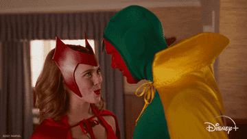 Wanda and Vision looking at each other and smiling in their Halloween costumes