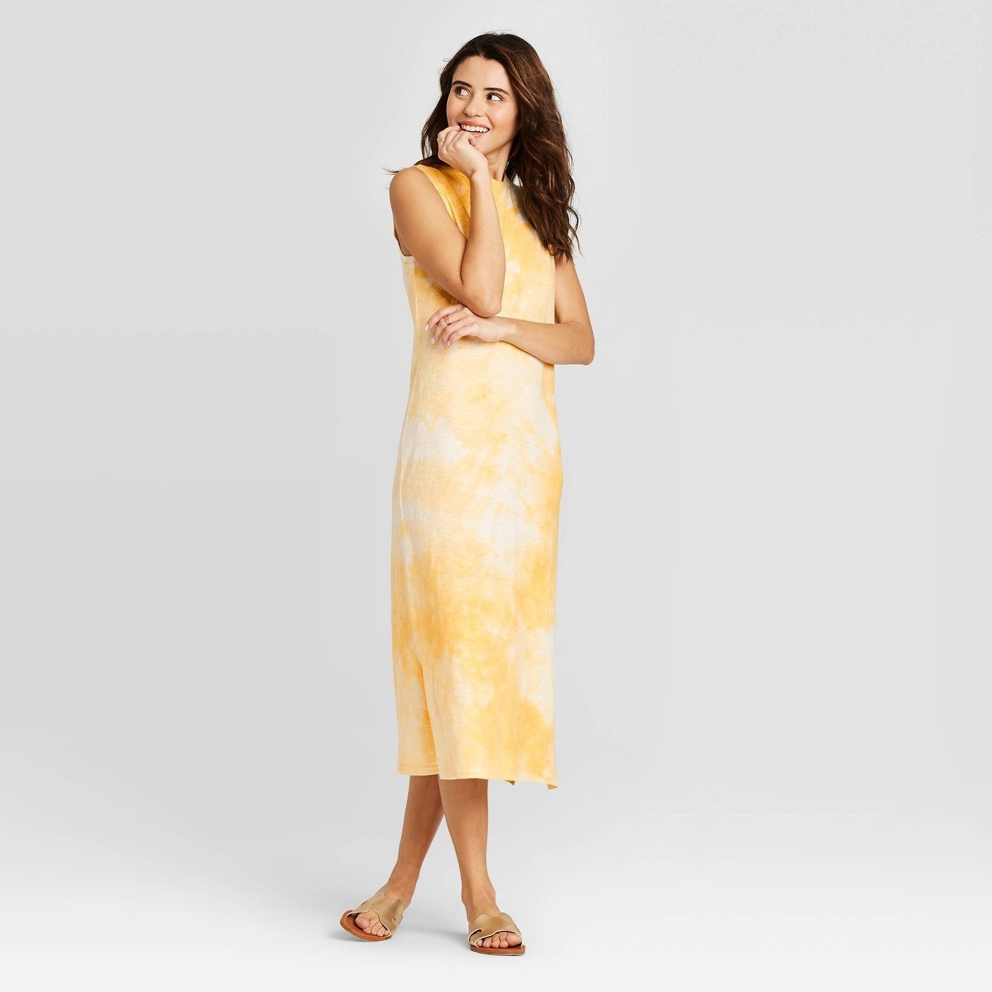 Model in yellow tie dye sleeveless dress
