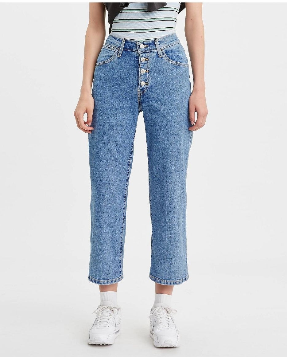 Model in ultra-high rise wide leg cropped jeans 