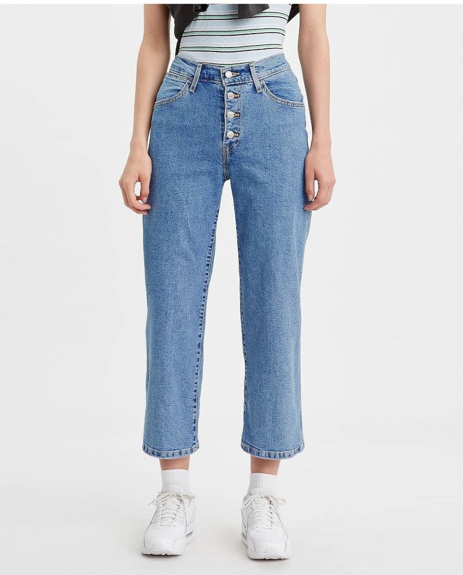Model in ultra-high rise wide leg cropped jeans