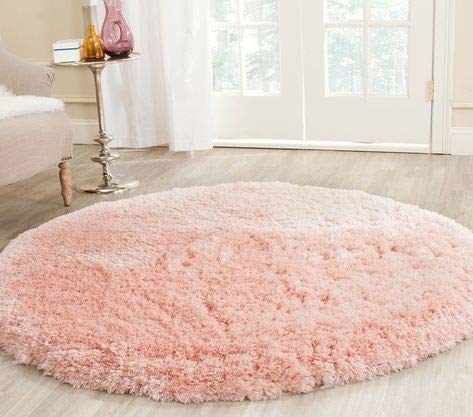 A circular shag carpet on the floor 