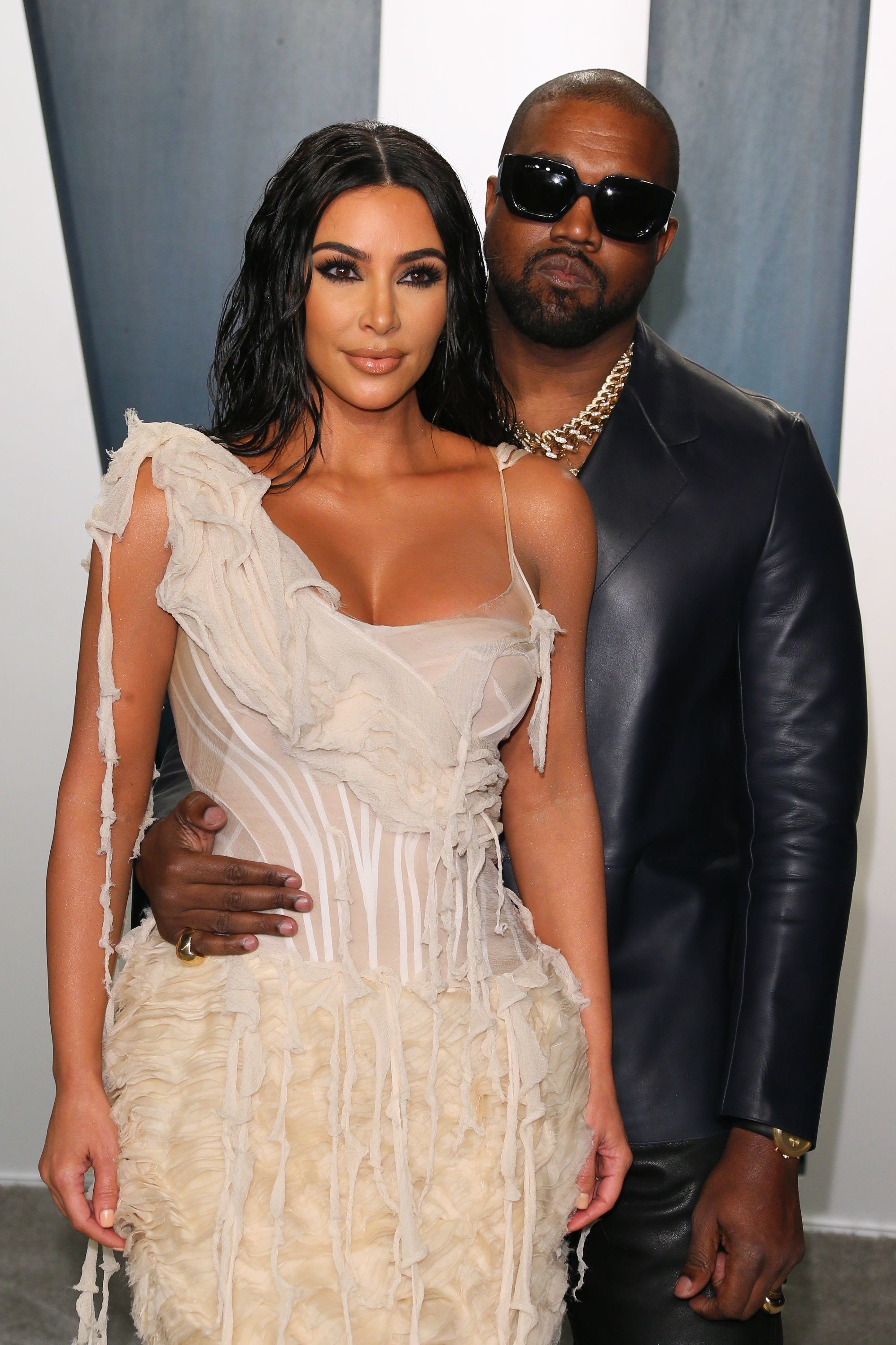 Kim and Kanye posing at a press event