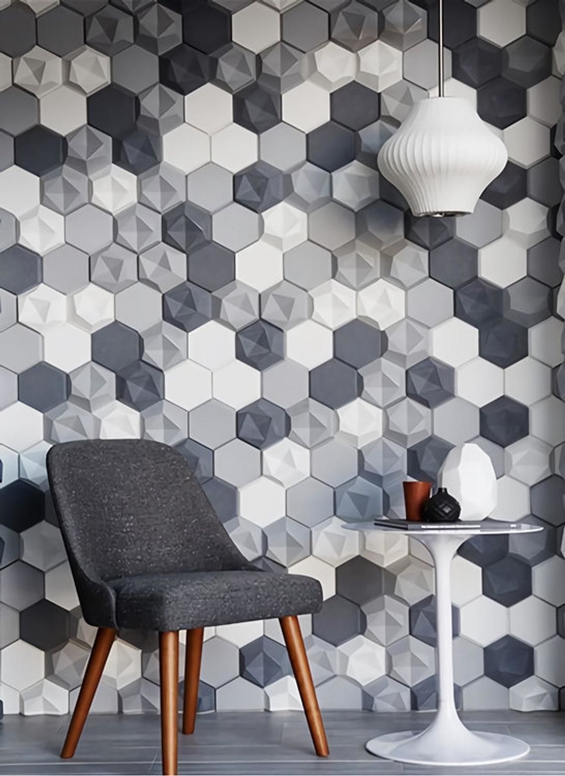 hexagonal tiles in various textures and shades of grey 