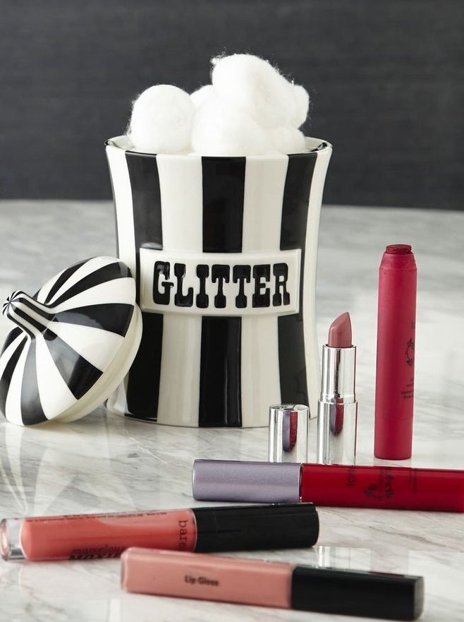 black and white vertical stripe canister with matching lid and the words &quot;Glitter&quot; written on the front