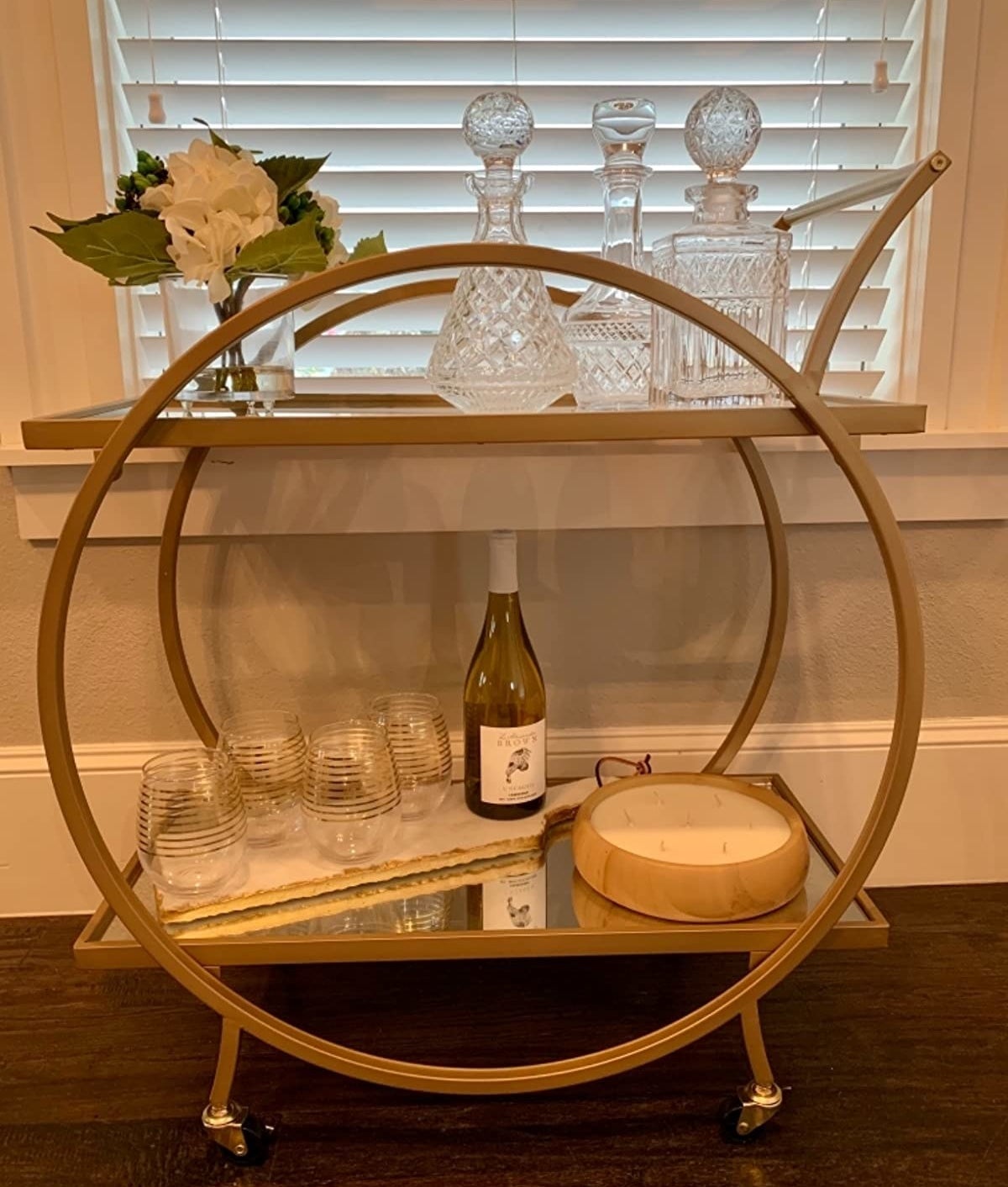 reviewer photo showing the round bar cart in gold