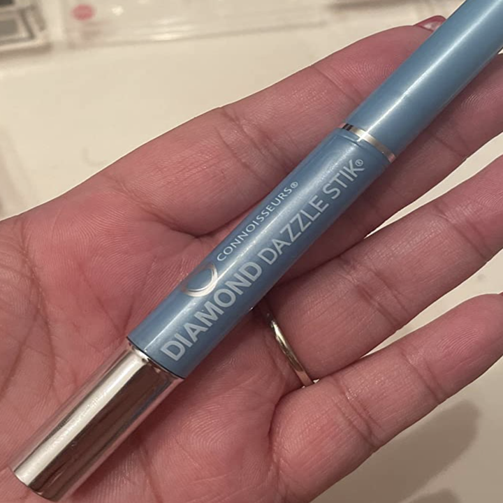 A customer review photo of them holding the Diamond Dazzle Stick