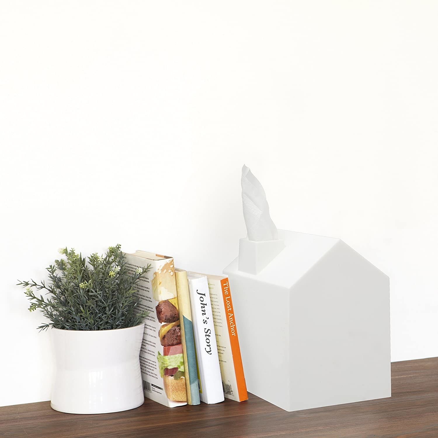 the tissue box next to books