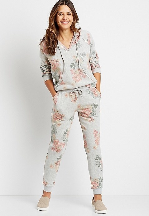 Model wearing grey floral jogging bottoms 