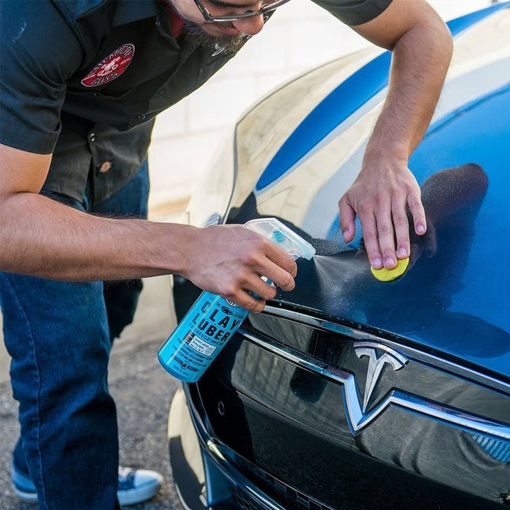 a model using the spray on the front of a car