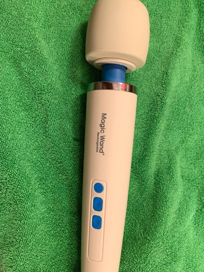 reviewer image of the New Hitachi Rechargeable Original Magic Wand Muscle Massager on a green towel