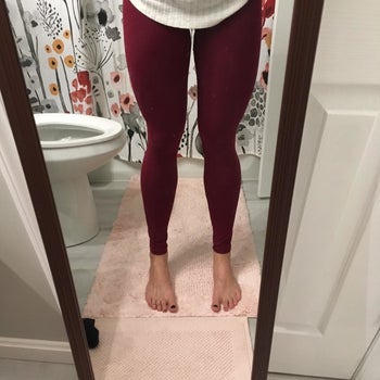 Reviewer wearing burgundy pair
