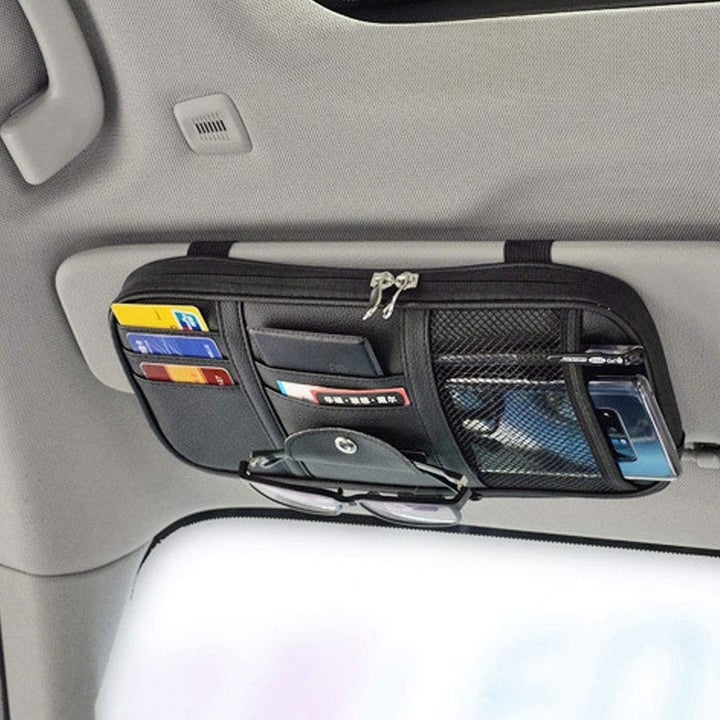 the organizer strapped to the visor with various pockets 