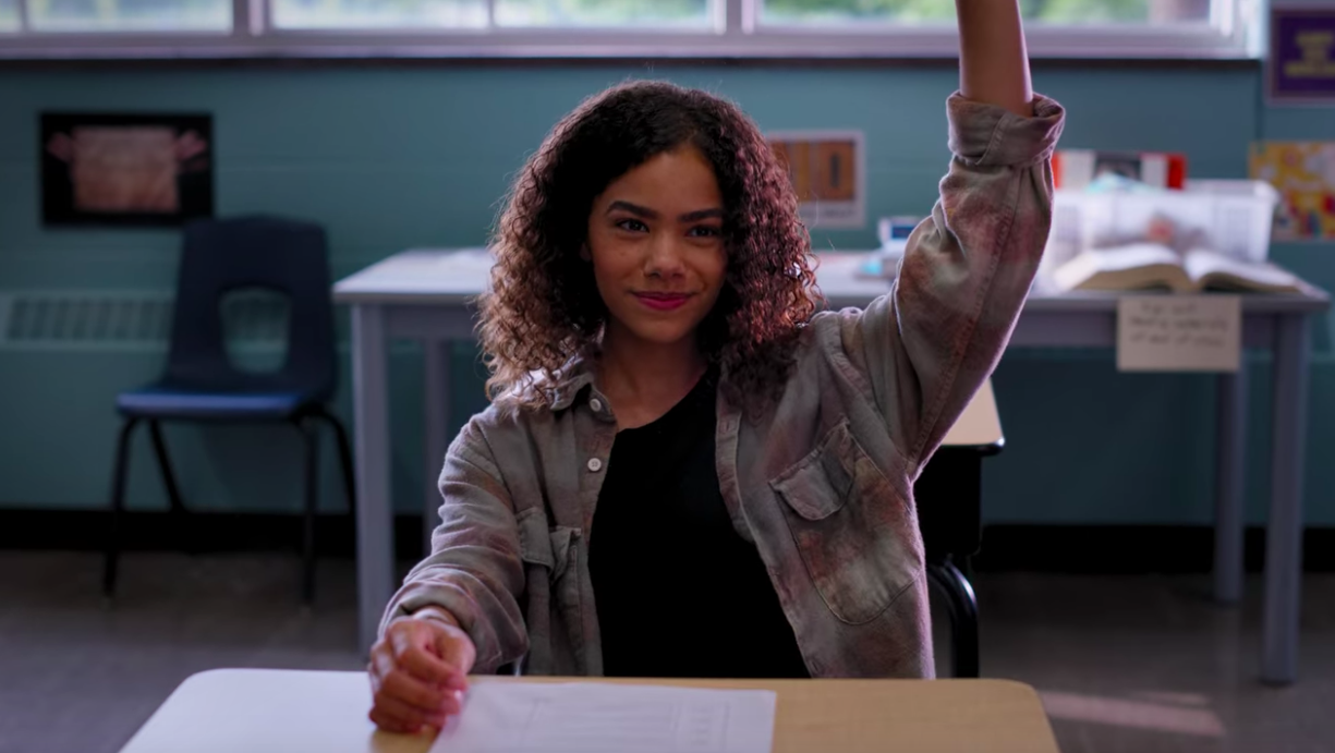 Ginny raising her hand in English class