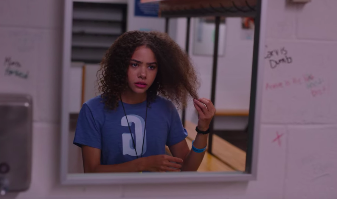 Ginny observing her hair in the bathroom at sophomore sleepover