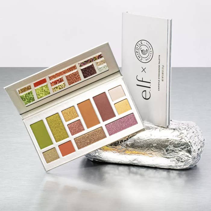 A silver makeup palette sitting on a Chipotle burrito that says &quot;E.l.f. x Chipotle&quot;