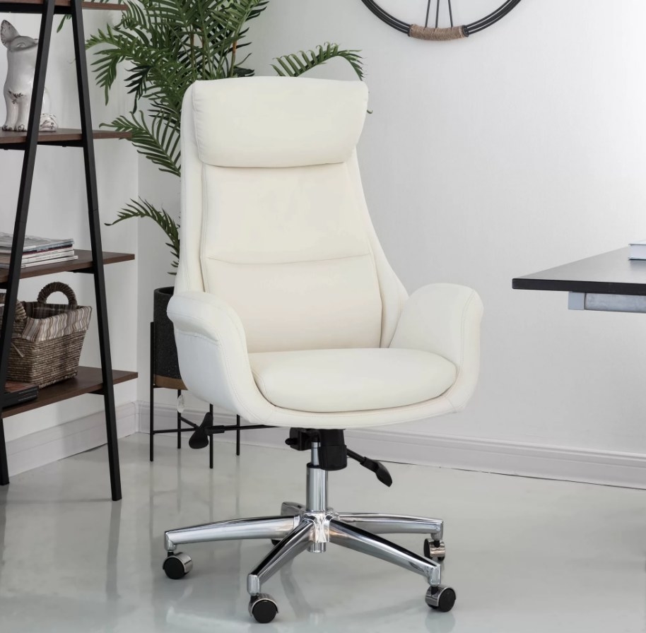 White swivel office chair with silver, wheeled legs