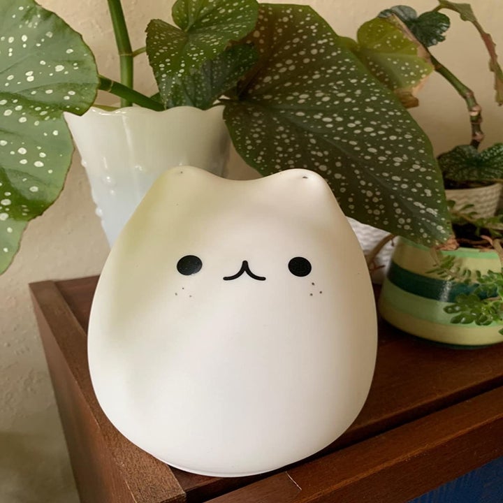 Reviewer photo of cat-shaped lamp on table
