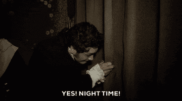 Gif of vampire looking out window and saying &quot;Yes! Night Time!&quot; 