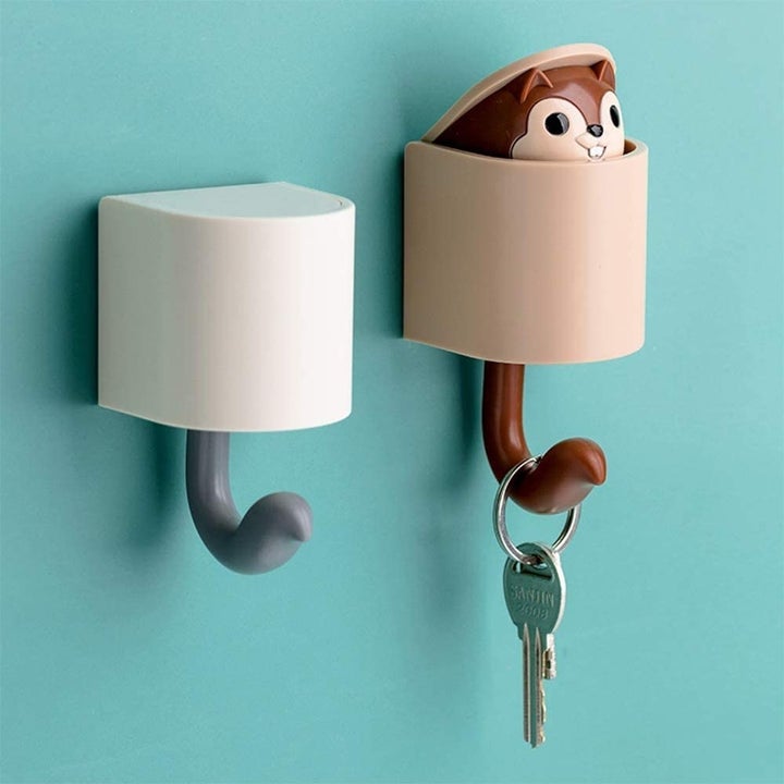 Two pop-up key holders with squirrel figure popping out