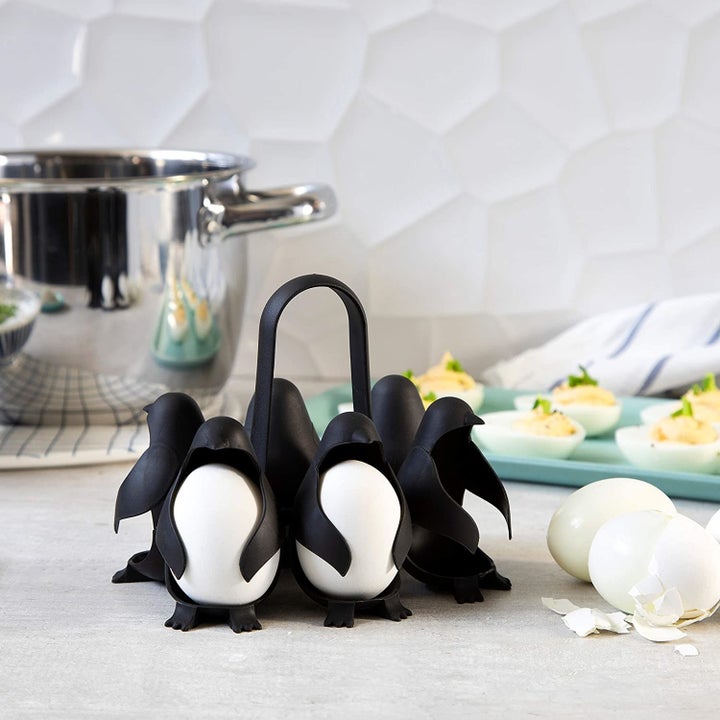 Penguin-shaped egg holder with eggs inside