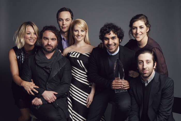 The cast of The Big Bang Theory posing with an award