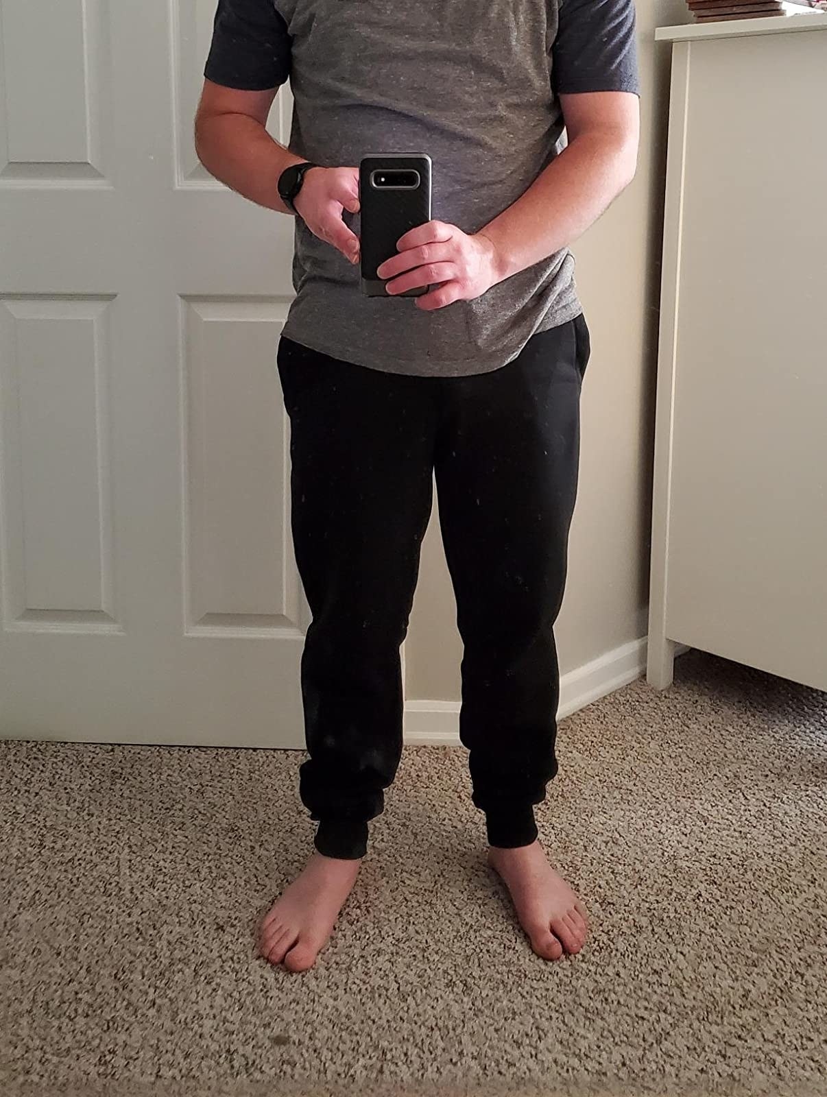 reviewer selfie wearing the joggers in black 