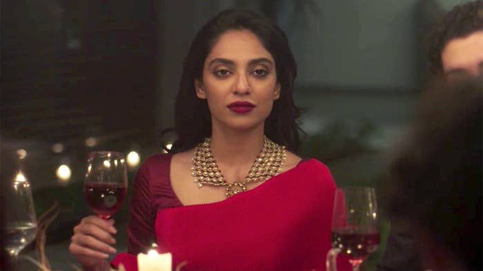 Shobhita Dhulipapa&#x27;s character sits at a dining table with a glass of wine in her hand