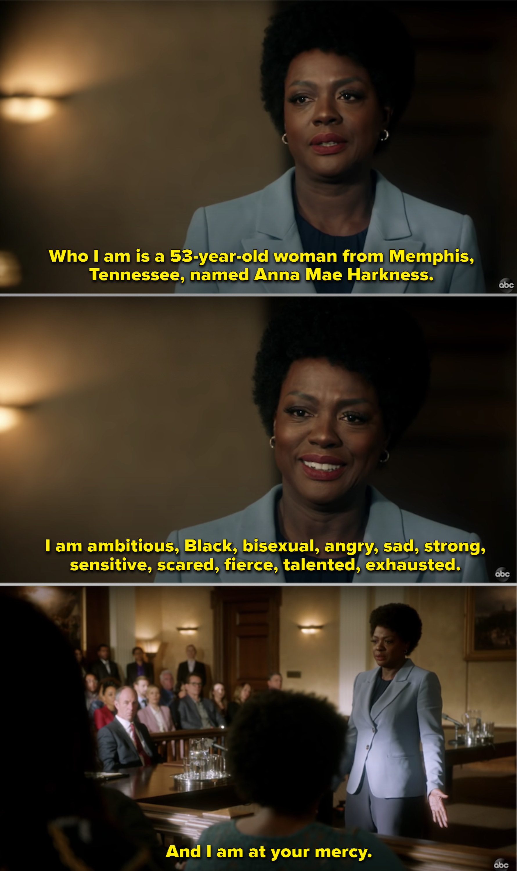 Annalise wearing a grey suit and speaking to the jury in court