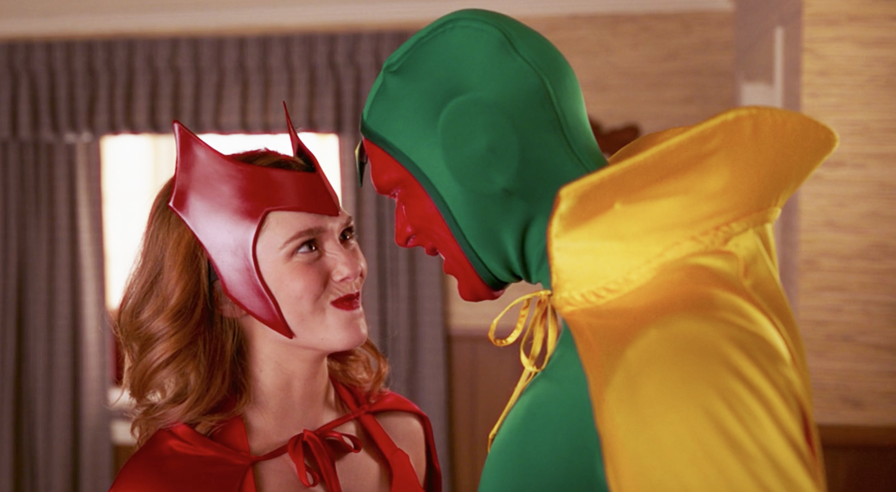 Wanda and Vision dressed up in Halloween costumes in a scene from WandaVision