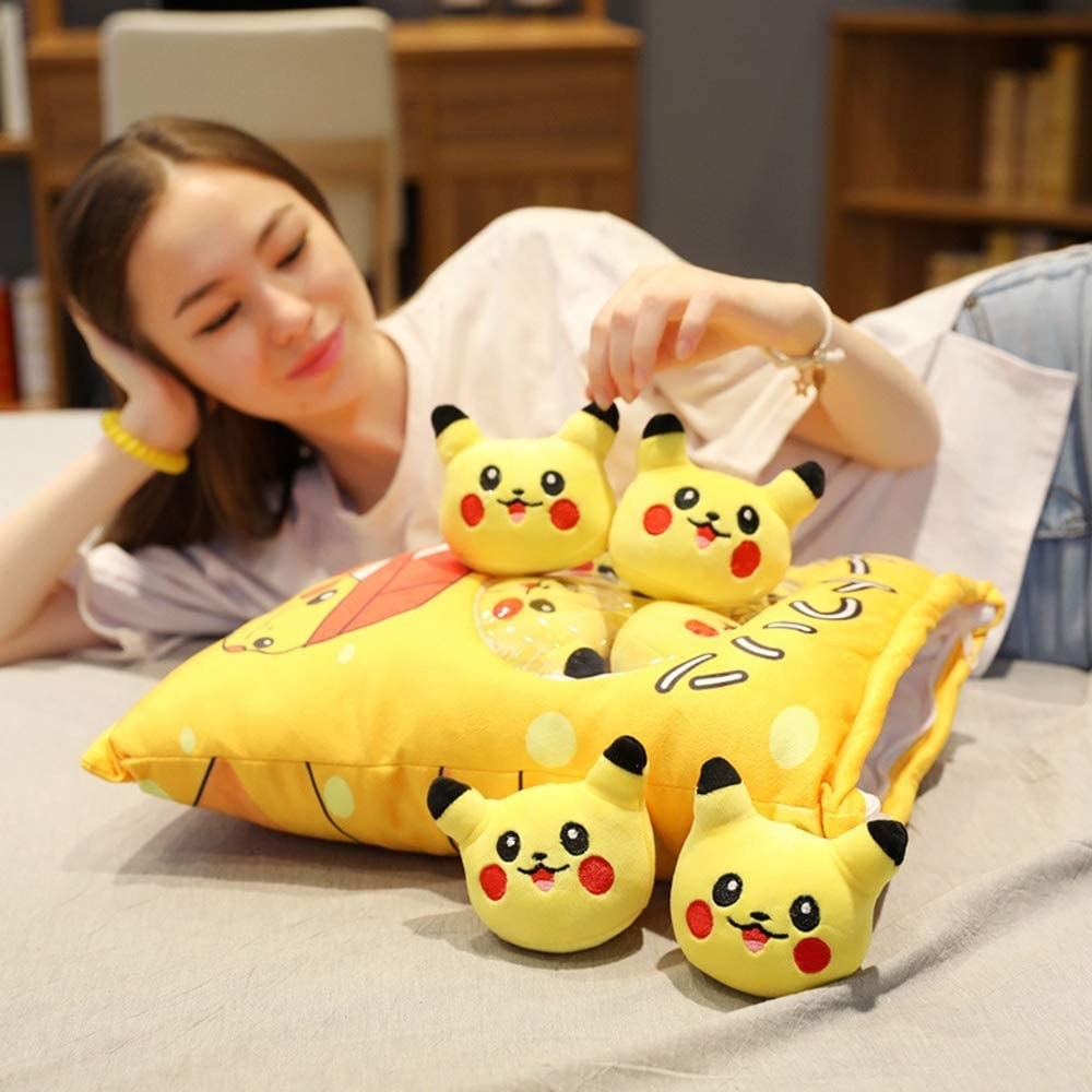 plush bag with clear window filled with round pikachus 