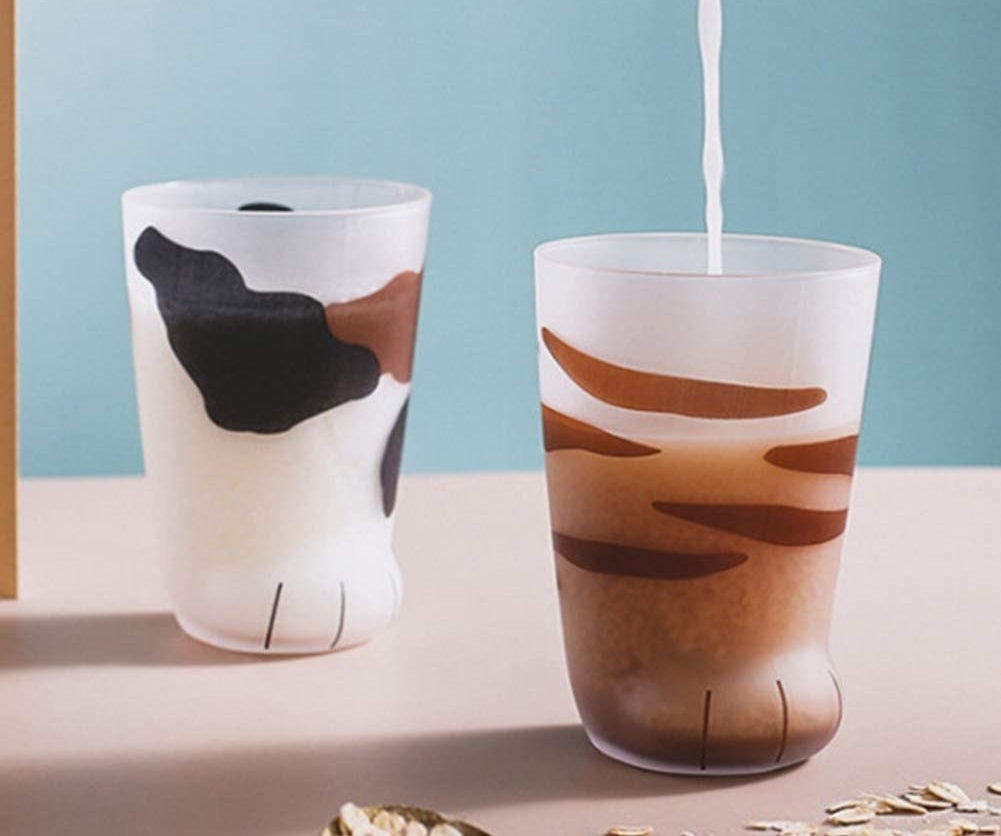 glasses shaped like cat paws with calico and stripe designs