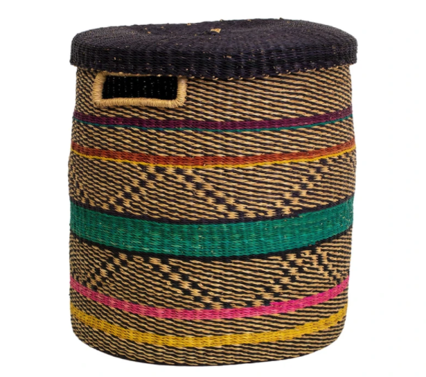 the woven hamper is a mix of tan, yellow, green, pink, and blue line designs 
