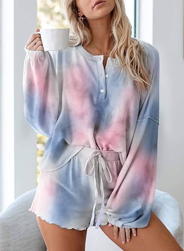 model wearing long sleeve top and matching shorts in a blended tie-dye print
