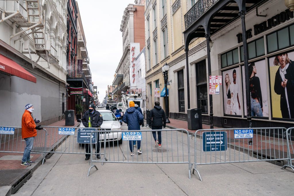 A mostly empty Bourbon Street closed off by barricades