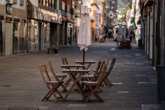 A deserted bar terrace in the otherwise busy street in San Cristobal