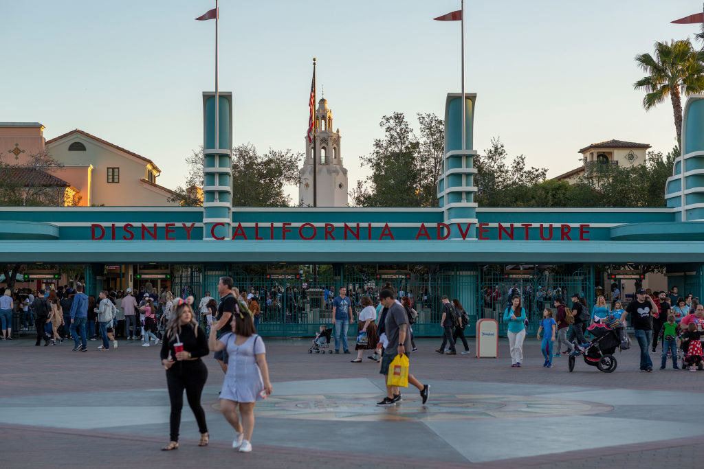 Crowds of people mill about the entrance to California Adventure