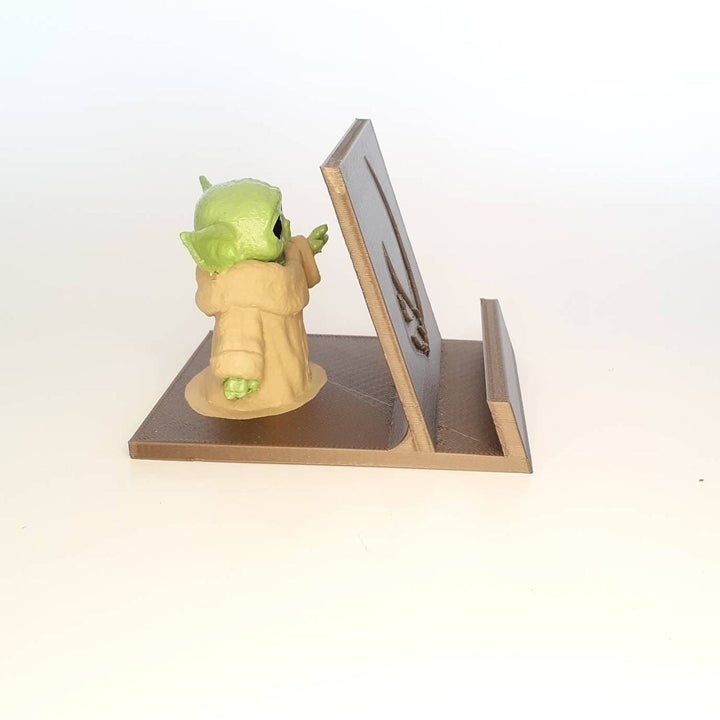 Phone holder with The Child figure on the back