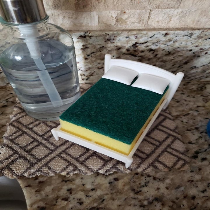 Reviewer photo of bed-shaped sponge holder on kitchen sink