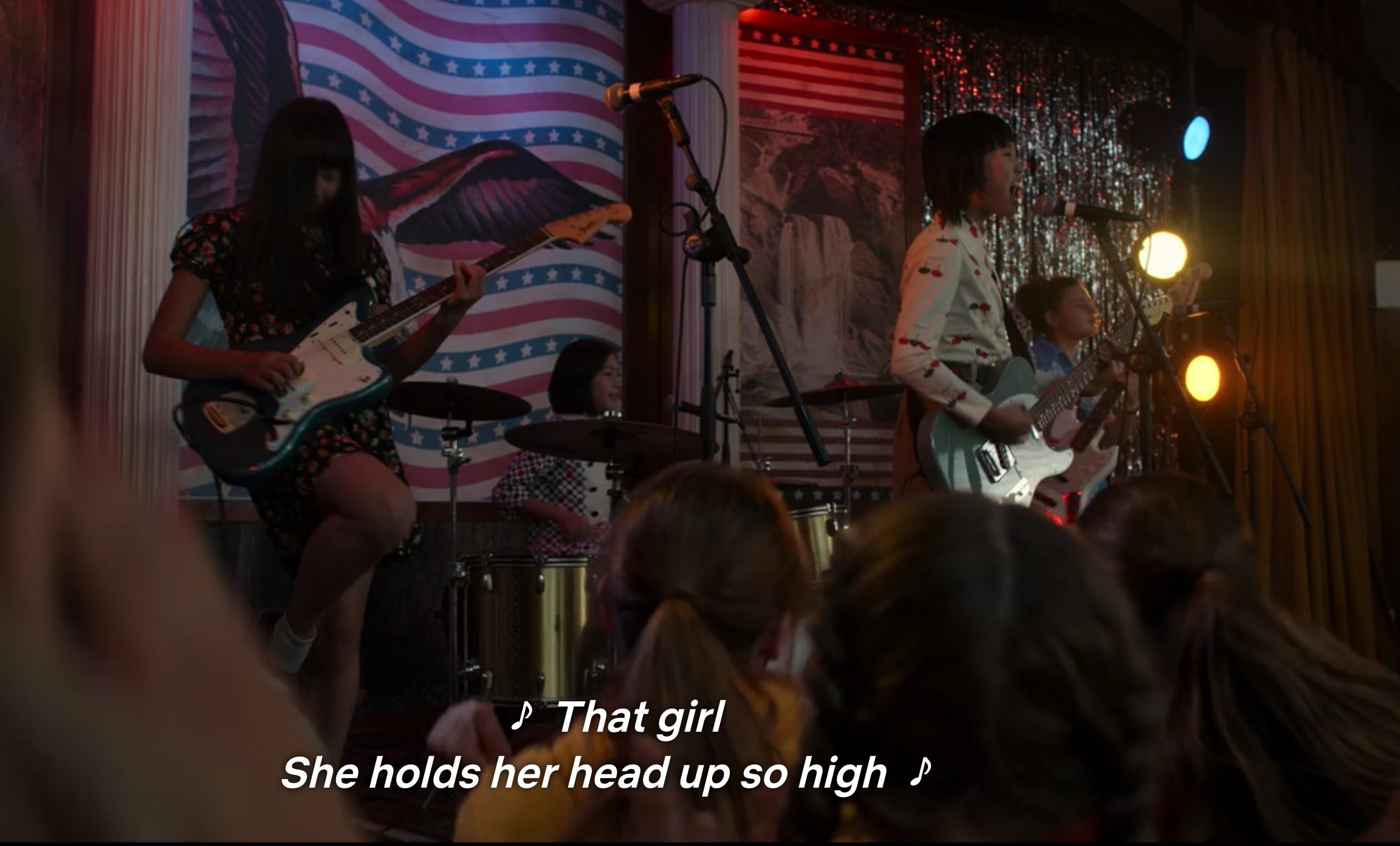 Punk band singing, &quot;That girl / She holds her head up so high&quot;